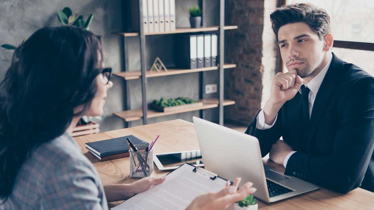 Spouse speaking with her Maryland divorce attorney