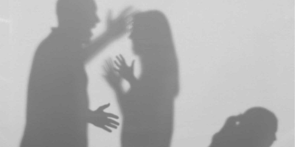 Silhouette of man yelling at woman