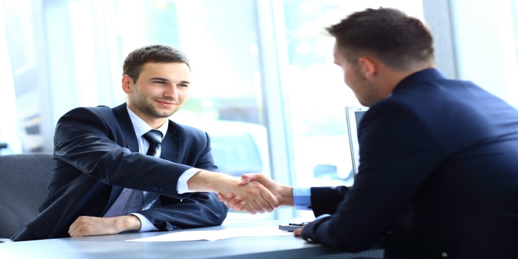 Man talking with divorce attorney about protecting assets