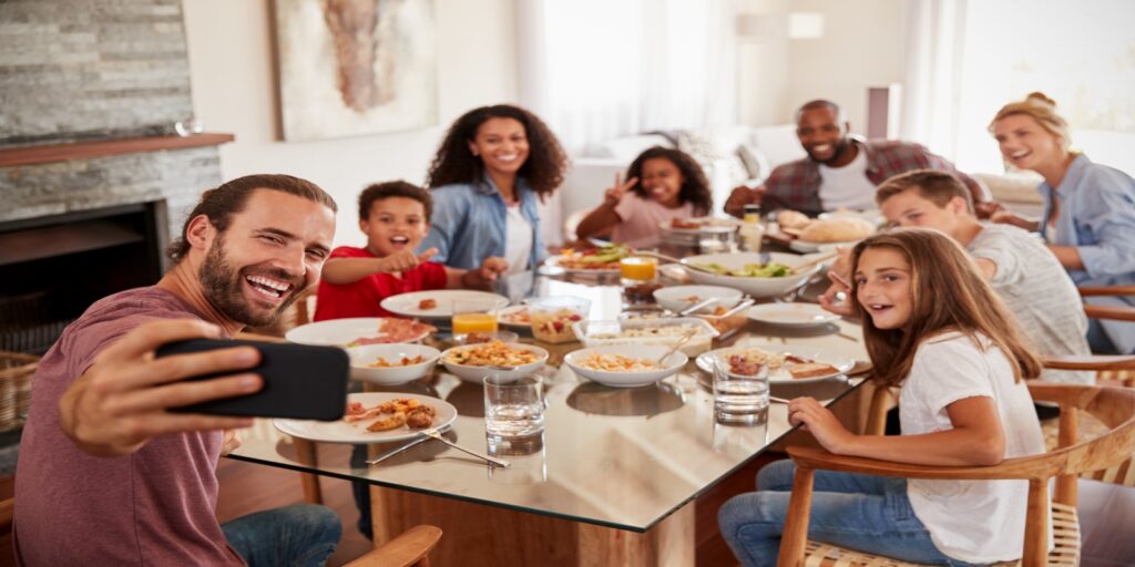 Happy remarried families having dinner