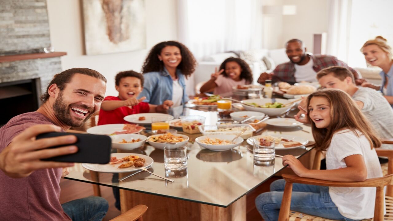 Happy remarried families having dinner