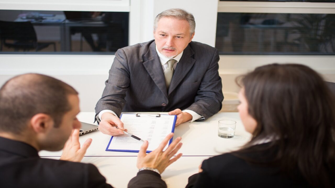 Divorced couple looking at separation agreements