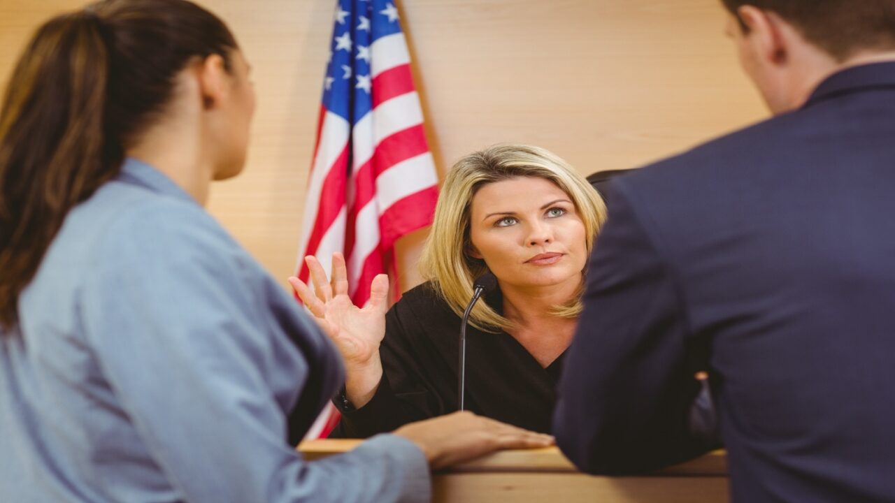 Man in Front of a Female Judge