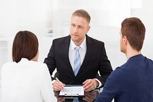 two parents speaking with a child custody lawyer