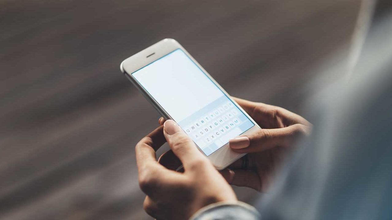 Woman on phone deciding if she needs an emergency hearing