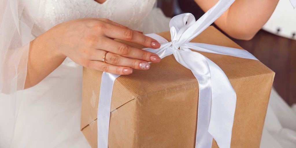 Bride opening up a wedding gift