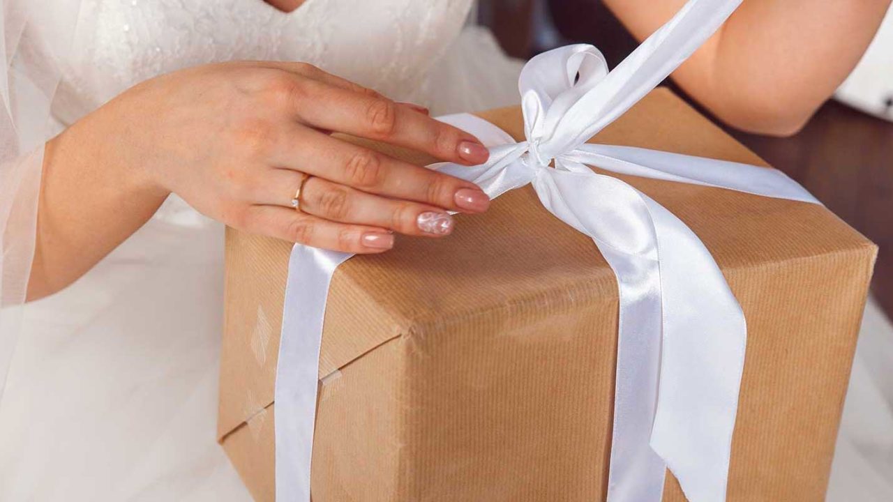 Bride opening up a wedding gift