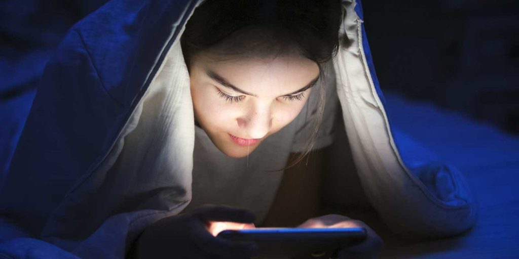 Child on phone looking at social media