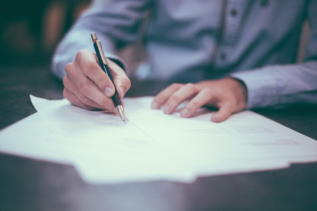 Maryland family law attorney signing divorce papers