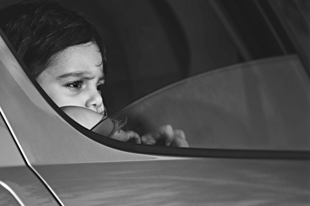 Child looking out the car window