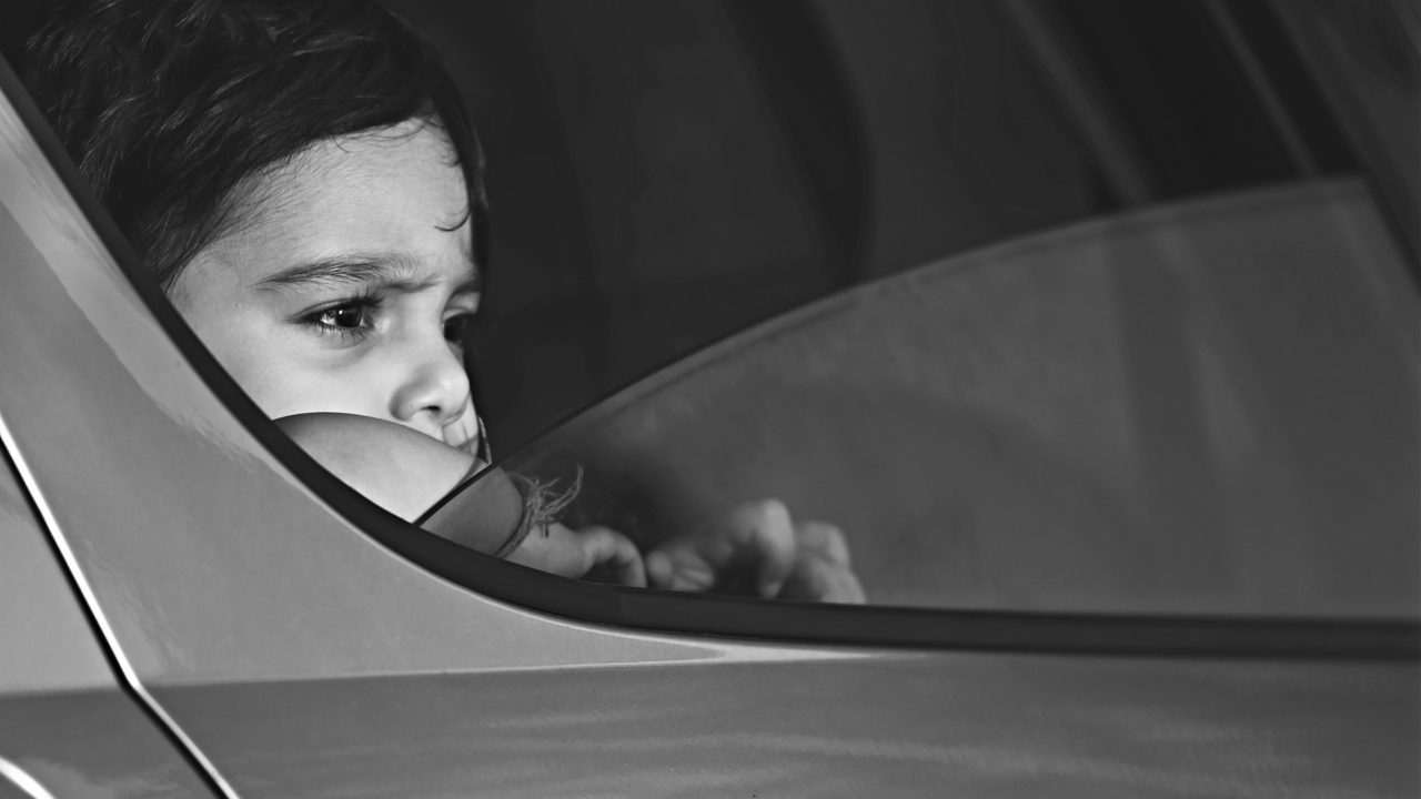 Child looking out the car window