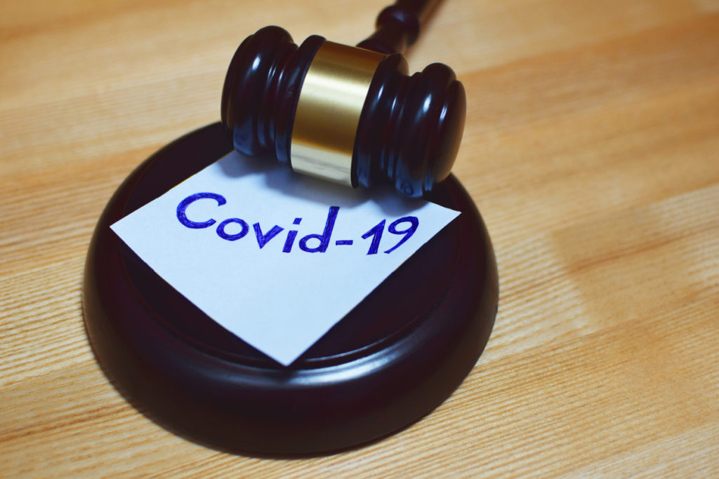 Gavel on COVID-19 sticky note