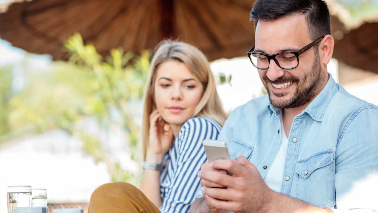 girlfriend looking at partners phone