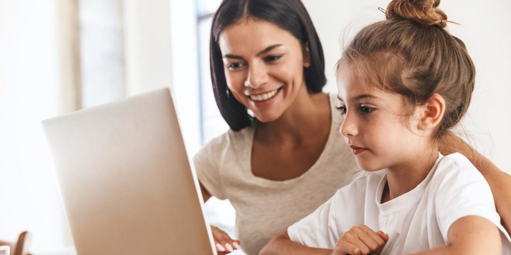 mother with daughter online school