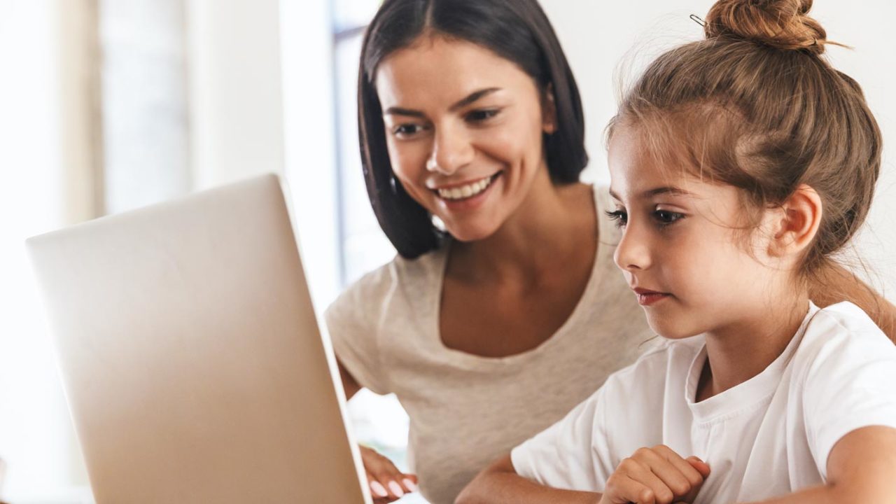 mother with daughter online school