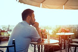 Man in aftermath of same sex divorce at table