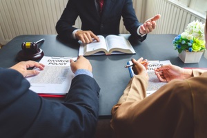 couple consulting a lawyer about federal retirement benefits