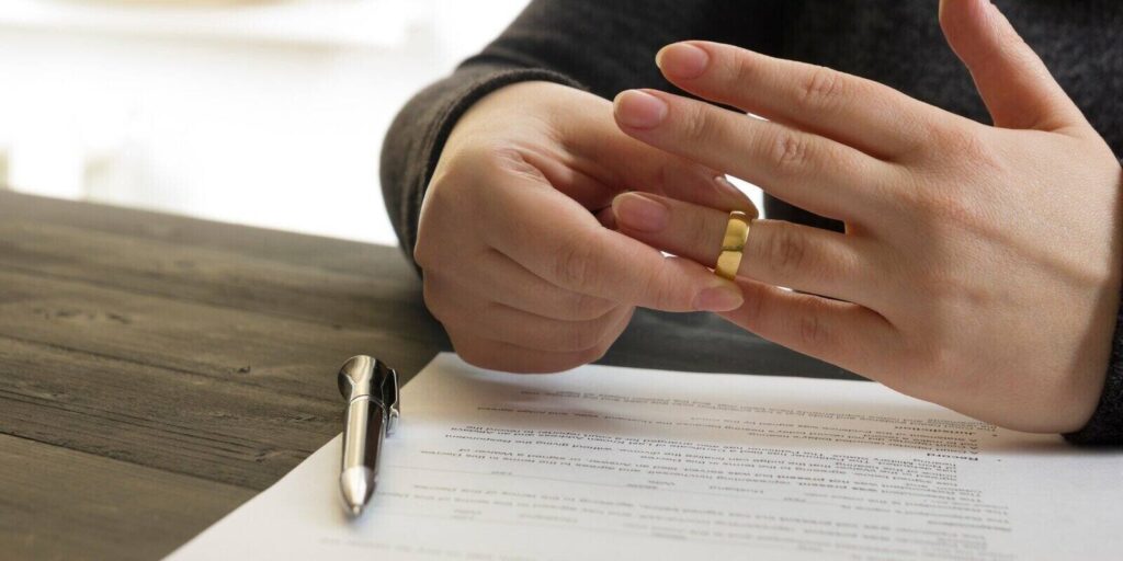 husband signing decree of divorce