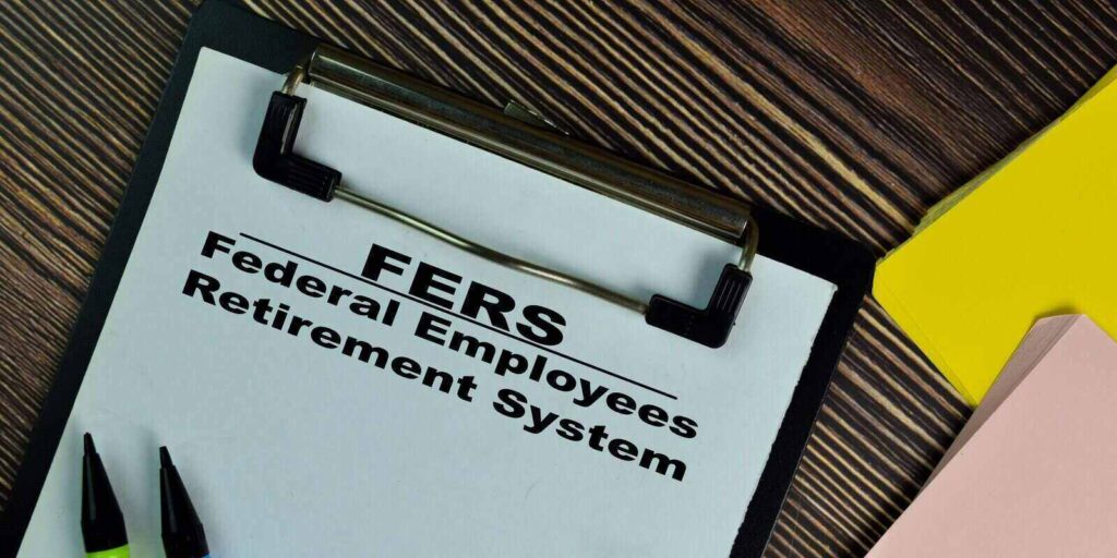 federal employees retirement system write on a paperwork isolated on wooden table
