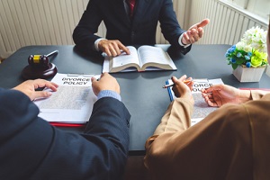 couple consulting a lawyer about agreement on the divorce