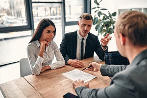 couple signing divorce agreement