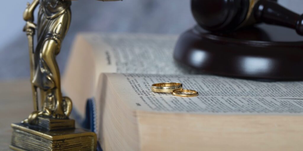 marriage rings on a thick book