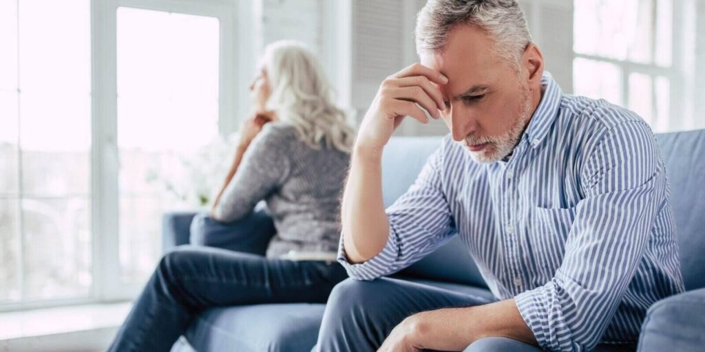 old man and attractive old woman are having relationship problems