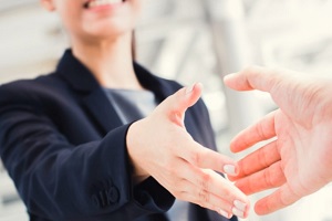 lawyer shaking hands with client