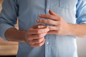 man taking out marriage ring