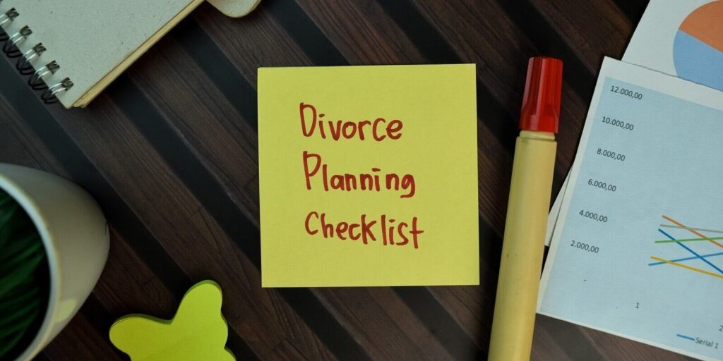 divorce planning checklist write on sticky notes isolated on wooden table