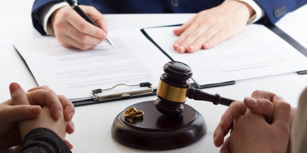 husband signing decree of divorce