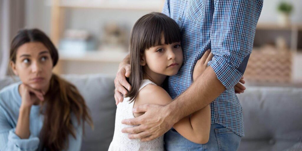 unhappy little child hug leaving parent say goodbye