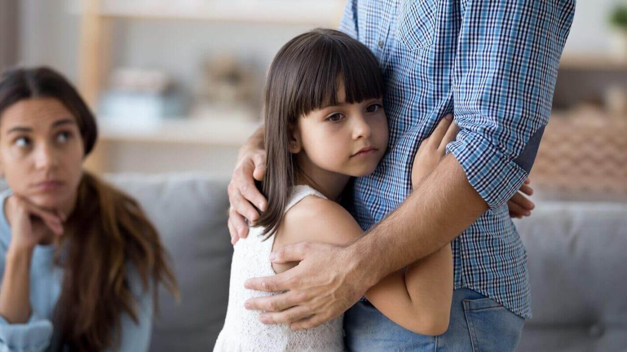 unhappy little child hug leaving parent say goodbye