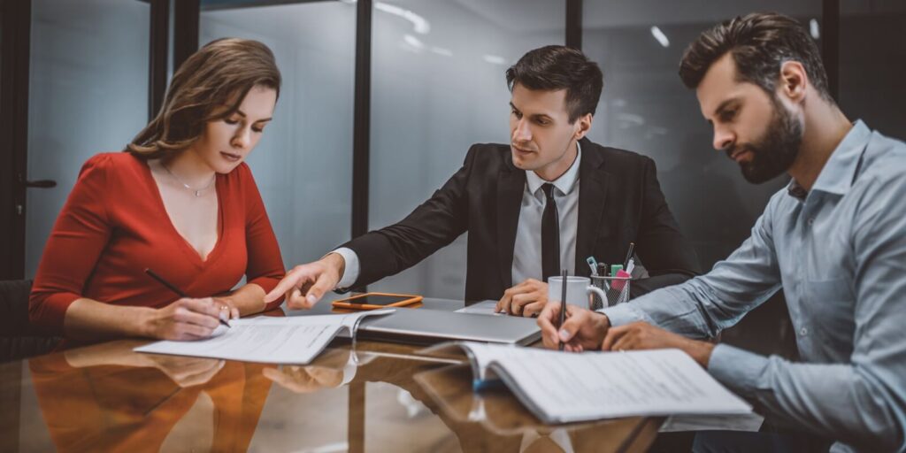 professional lawyer consulting spouses about legal documents