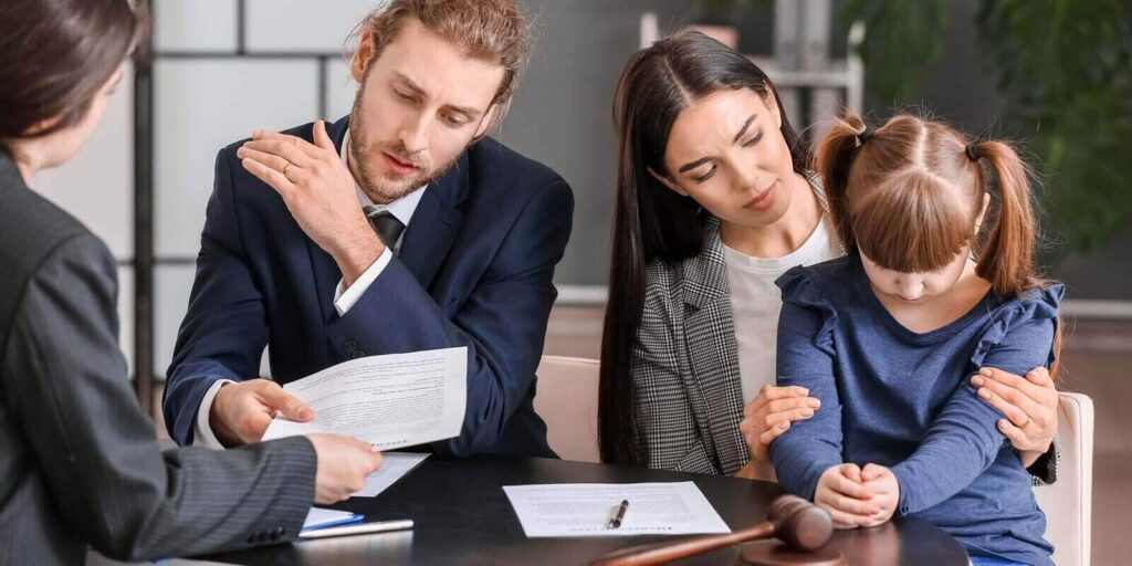 young couple and their daughter visiting divorce lawyer in office