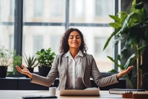 beautiful young divorce attorney relaxing and doing yoga at her office