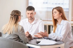 young couple visiting divorce lawyer in Laurel, MD office