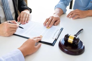 couple husband and wife during divorce process listening to lawyer discuss men's rights