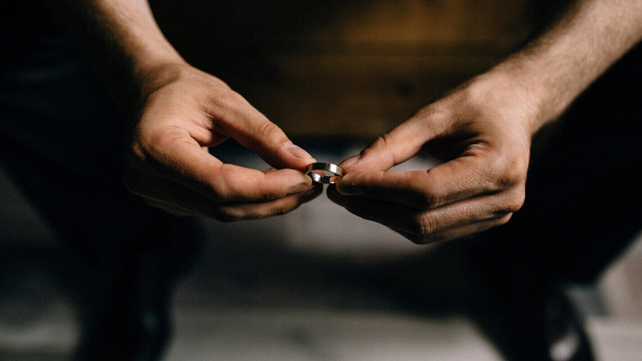 man holds rings