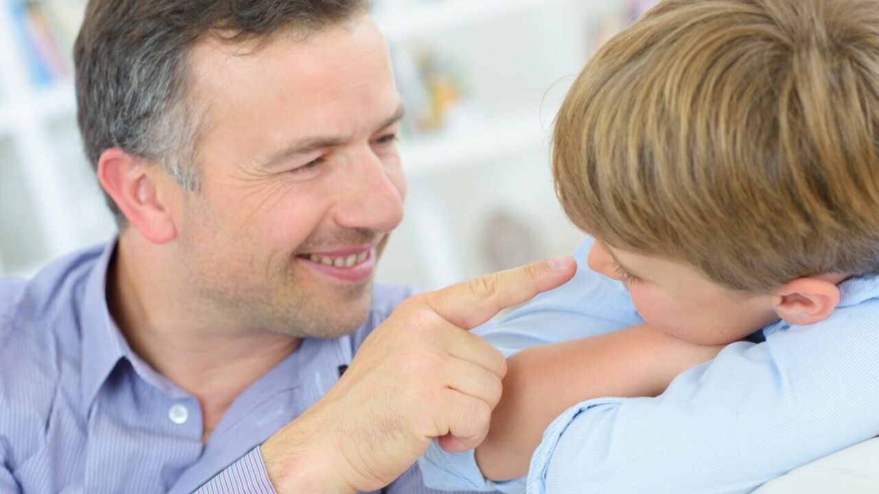 a father and son at home