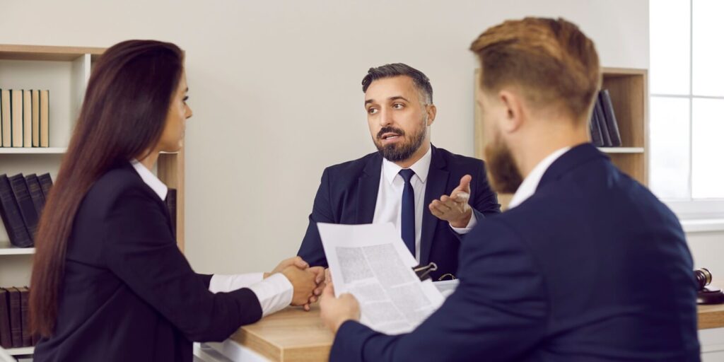 family lawyer in suit speaking to clients