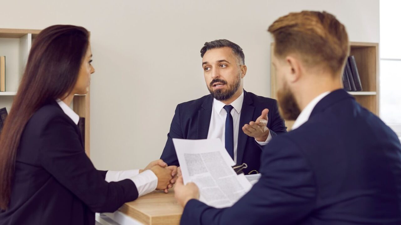 family lawyer in suit speaking to clients