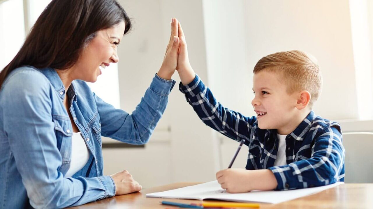 homework teaching boy high five education mother children son familiy childhood