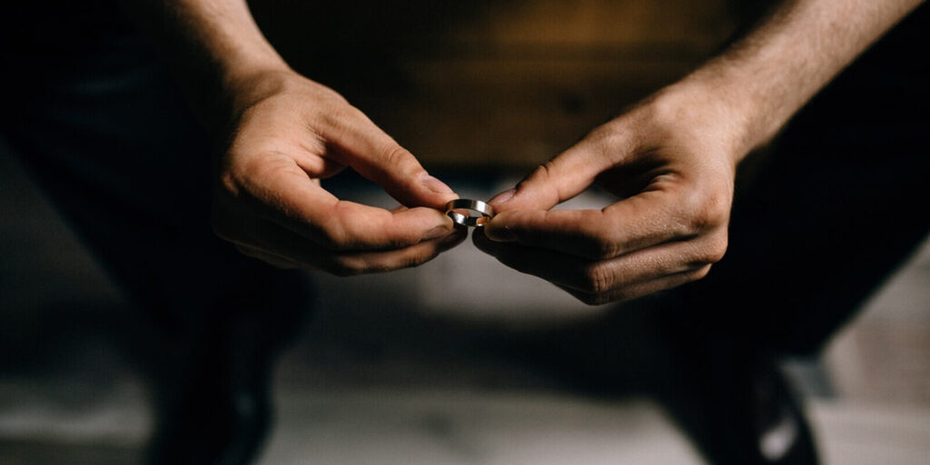 man holds rings