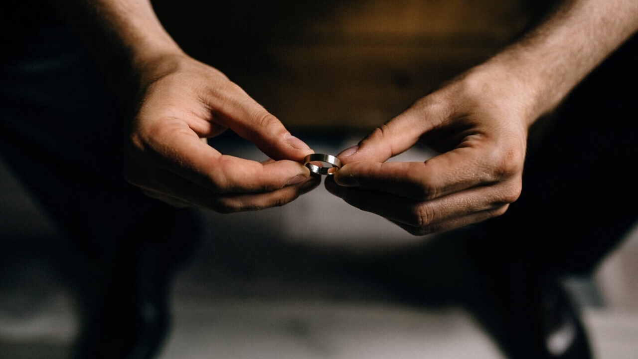 man holds rings