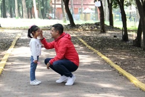 latino divorced single dad and daughter walk in the park and spend quality time with physical activity