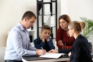 divorced parents with their son visiting lawyer