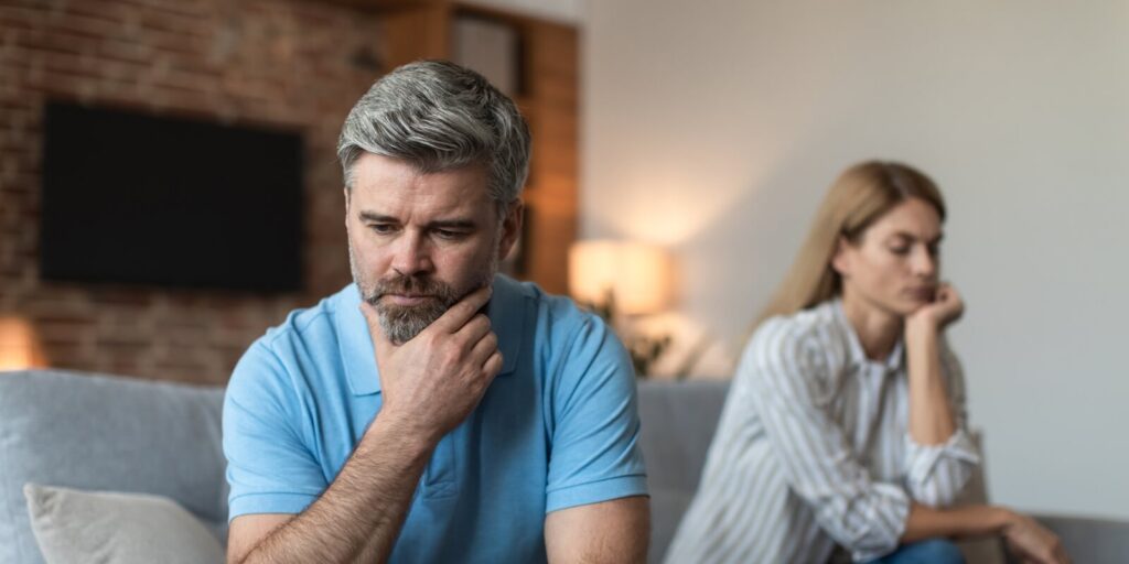 despair mature caucasian male and lady ignoring each other after quarrel and thinking about breaking up