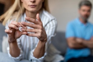 women taking out her wedding ring