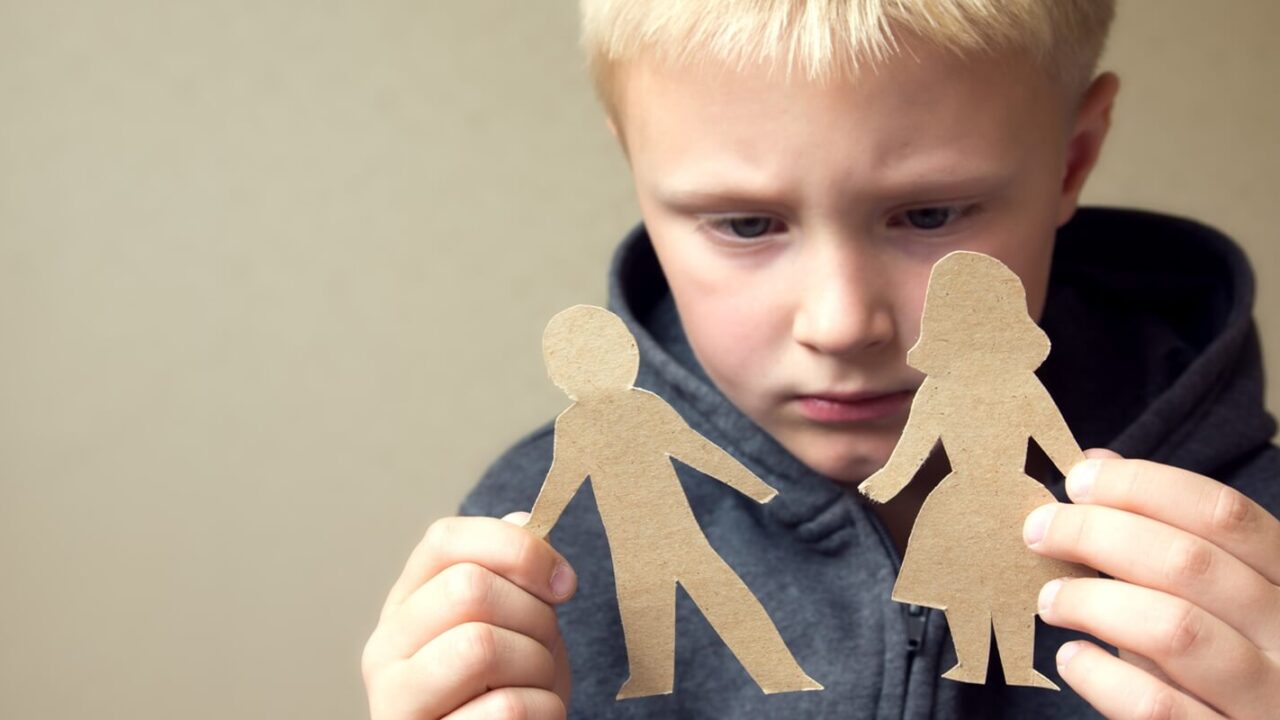 confused child with paper parents